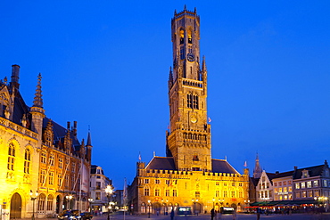 The Belfry and Market Square lit up at night in the Historic Center of Bruges, UNESCO World Heritage Site, Belgium, Europe