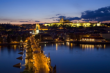 Charles Bridge over the River Vltava and Little Quarter illuminated at dusk, UNESCO World Heritage Site, Prague, Czech Republic, Europe