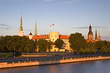 Riga Castle and the River Daugava illuminated at sunset, Riga, Latvia, Europe