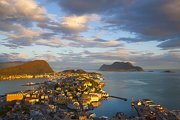 Elevated view over Alesund illuminated at sunset, Sunnmore, More og Romsdal, Norway, Scandinavia, Europe