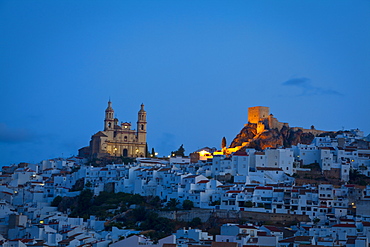 The hilltop village of Olvera illuminated at dawn, Olvera, Cadiz Province, Andalusia, Spain, Europe