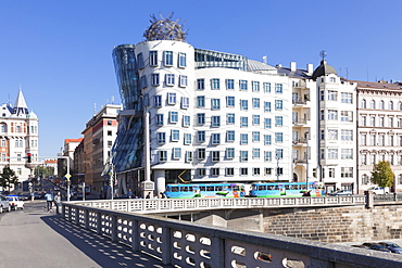 Tram in front of the Dancing House (Ginger and Fred) by Frank Gehry, Prague, Bohemia, Czech Republic, Europe 