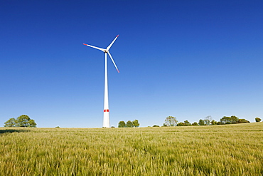 Wind turbine on a field in the evening light, Black Forest, Baden Wurttemberg, Germany, Europe