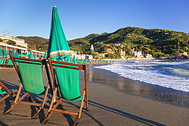 Sun umbrella and chair at the beach of Levanto, Riviera de Levanto, Cinque Terre, Liguria, Italy, Europe