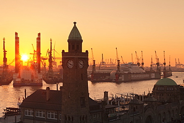 St. Pauli Landungsbruecken pier against harbour at sunset, Hamburg, Hanseatic City, Germany, Europe