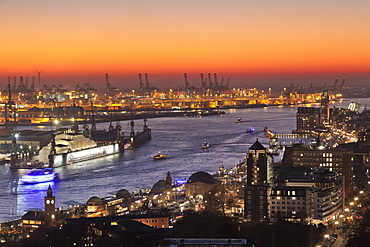 View over St. Pauli district and St. Pauli Landungsbruecken pier over the harbour at sunset, Hamburg, Hanseatic City, Germany, Europe