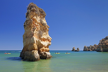 Praia da Dona Ana beach, group of kayaks on a trip to Ponta da Piedade Cape, Lagos, Algarve, Portugal, Europe