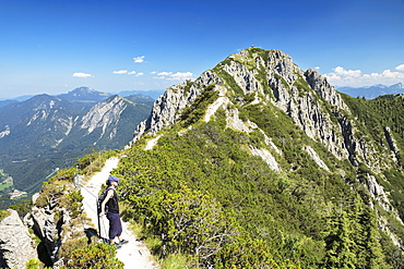 Hiker on Gratweg Trail from Heimgarten to Herzogstand Mountain, Upper Bavaria, Bavaria, Germany, Europe