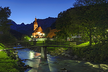 Church by Ramsauer Ache river at night in Bavaria, Germany, Europe