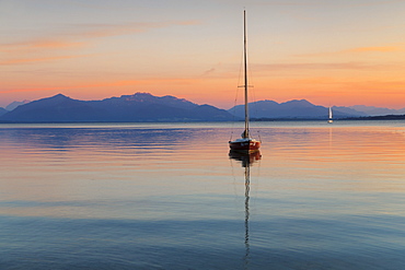 Sailing boat at sunset, Lake Chiemsee and Chiemgau Alps, Upper Bavaria, Germany, Europe