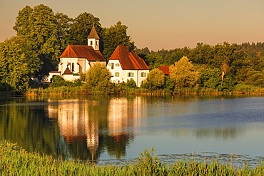 St. Walburgis Church at Seeon Abbey at Lake Seeoner See at sunrise, Chiemgau, Chiemgau Alps, Upper Bavaria, Germany, Europe