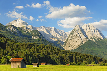 Hay barns at Hammersbach Footpath against Wetterstein Mountain Range, Garmisch-Partenkirchen, Werdenfelser Land, Upper Bavaria, Germany, Europe