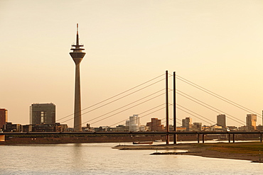 Rheinturm tower, Rheinkniebruecke bridge and Media Harbour (Medienhafen), Dusseldorf, North Rhine Westphalia, Germany, Europe