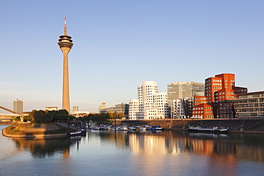 Neuer Zollhof, designed by Frank Gehry, Rheinturm tower, Media Harbour (Medienhafen), Dusseldorf, North Rhine Westphalia, Germany, Europe