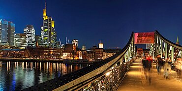 View from Eiserner Steg Bridge across Main River to the skyline of Frankfurt am Main, Hesse, Germany