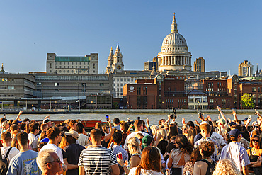 People enjoying a summer evening at Bankside, London, England
