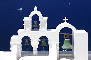 White bell tower and sailing boat, Oia, Santorini, Cyclades, Aegean Sea, Greek Islands, Greece, Europe 