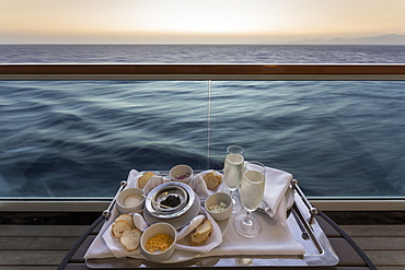 Chilled champagne and caviar with all the trimmings, al fresco on a luxury cruise ship, Red Sea, near Sharm El Sheikh, Egypt, North Africa