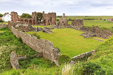 Lindisfarne Priory, early Christian site, and village, elevated view, Holy Island, Northumberland Coast, England, United Kingdom, Europe