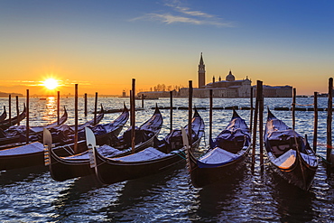 Venetian winter sunrise after snow with gondolas, San Giorgio Maggiore and Lido, Venice, UNESCO World Heritage Site, Veneto, Italy, Europe