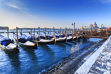 Gondolas with view to Basilica di Santa Maria della Salute after snow, Venice, UNESCO World Heritage Site, Veneto, Italy, Europe