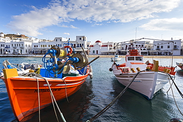 Colourful boats in harbour, whitewashed Mykonos Town (Chora) with windmills and churches, Mykonos, Cyclades, Greek Islands, Greece, Europe