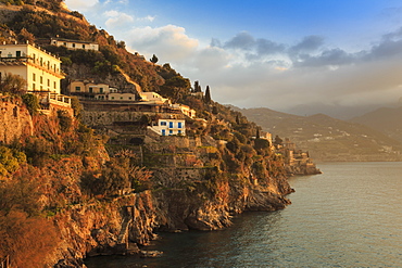 Sunrise lights up villas, misty dawn on the Amalfi Coast, near Atrani in spring, UNESCO World Heritage Site, Campania, Italy, Europe