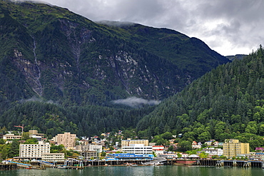 Juneau, State Capital, view from the sea, mist clears over downtown buildings, mountains, forest and float planes, Alaksa, United States of America, North America