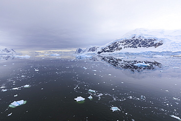 Atmospheric iceberg, mountain and glacier reflections, Neko Harbour, Andvord Bay, Graham Land, Antarctic Peninsula, Antarctica, Polar Regions