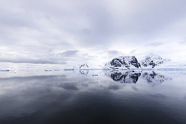 Atmospheric iceberg, mountain and glacier reflections, Neko Harbour, Andvord Bay, Graham Land, Antarctic Peninsula, Antarctica, Polar Regions