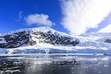 Early morning on a gorgeous day, rainbows in the clearing mist of Neko Harbour, Andvord Bay, Antarctic Continent, Antarctica, Polar Regions