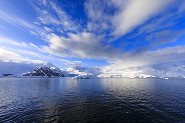 Early morning atmospheric cloud and mist, mountains, glaciers and icebergs, Neko Harbour, Andvord Bay, Graham Land, Antarctica, Polar Regions