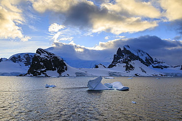 Sunrise, atmospheric clouds, mountains, glaciers and icebergs, Danco Coast, Gerlache Strait, Antarctic Peninsula, Antarctica, Polar Regions