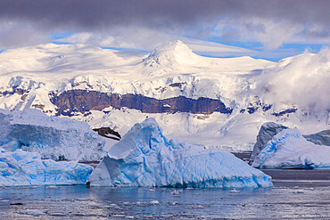 Blue icebergs and mountains, off Cuverville Island, Errera Channel, Danco Coast, Antarctic Peninsula, Antarctica, Polar Regions