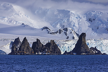 Pinnacle rocks, glaciers, mountains of Greenwich Island, from the sea, bright, misty weather, South Shetland Islands, Antarctica, Polar Regions