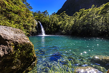 Waterfall, lake and blue sky, Petrohue Los Enamorados Trail, Vicente Perez Rosales National Park, Spring, Lakes District, Chile, South America