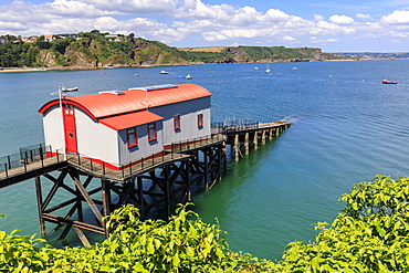 Former Lifeboat Station, distant cliffs and countryside, on a sunny day, Tenby, Pembrokeshire, Wales, United Kingdom, Europe