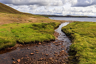 Little Ayre, burn, red sand and granite beach and rocks, Muckle Roe Island, Shetland Isles, Scotland, United Kingdom, Europe