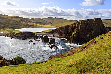 North Ham Bay, deep inlet, elevated view, red granite cliffs, stacks, Town Loch, Muckle Roe Island, Shetland Isles, Scotland, United Kingdom, Europe