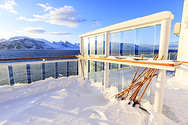 Cruise ship on an Arctic Winter voyage, deep fresh powder snow on decks, off Troms County, North Norway, Scandinavia, Europe