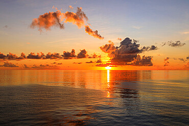 Sunset over beautiful calm sea, interesting clouds, vibrant colours, St. Kitts, St. Kitts and Nevis, Leeward Islands, West Indies, Caribbean, Central America