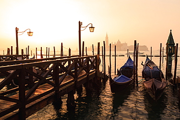 Venetian sunrise, winter fog, gondolas, San Giorgio Maggiore and Lido, Venice, UNESCO World Heritage Site, Veneto, Italy, Europe