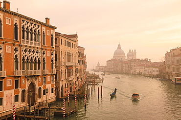 Beautiful Grand Canal, winter fog, morning golden light, Santa Maria della Salute, Venice, UNESCO World Heritage Site, Veneto, Italy, Europe