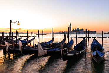 Beautiful Venetian sunrise in winter, gondolas, San Giorgio Maggiore and Lido, Venice, UNESCO World Heritage Site, Veneto, Italy, Europe