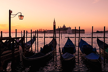 Beautiful Venetian sunrise in winter, gondolas, San Giorgio Maggiore and Lido, Venice, UNESCO World Heritage Site, Veneto, Italy, Europe