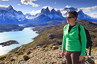 Hiker at Condor Vista Point, Lago Pehoe and the Cordillera del Paine, Torres del Paine National Park, Patagonia, Chile, South America