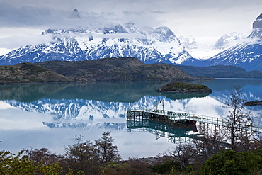 Boatdock and late evenng reflections in Lago Pehoe, Torres del Paine National Park, Patagonia, Chile, South America