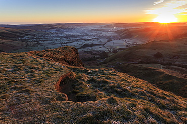 Mam Tor (Shivering Mountain), exposed east face strata lit by rising sun in winter, Castleton, Peak District, Derbyshire, England, United Kingdom, Europe