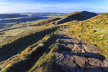 Steps up Mam Tor, view towards Rushup Edge, distant fields and hills in winter, Castleton, Peak District, Derbyshire, England, United Kingdom, Europe