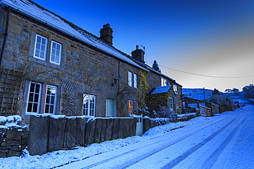 Stone cottages, on country lane at blue hour, fresh winter snowfall, Curbar, Peak District National Park, Derbyshire, England, United Kingdom, Europe